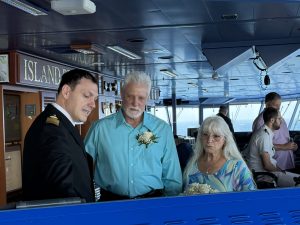 Captain Marco with Tim and Mary after their wedding! Marsh talking to the second officer.