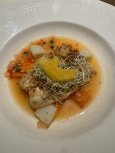 Cobia with citrus sauce.