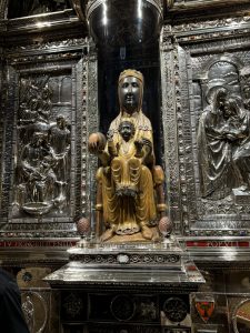 The statue is behind glass, except for the orb, which tradition has it that you put your hand on it, you can make 1 prayer directly to her.