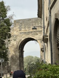 The walls around the town, to protect the popes.