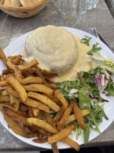 Believe it or not, under that pile of cheesy goodness is a hamburger. It's called the Fondue Burger.
