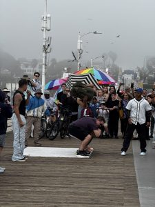 Men dancing on a cloudy day Santa Monica Pier